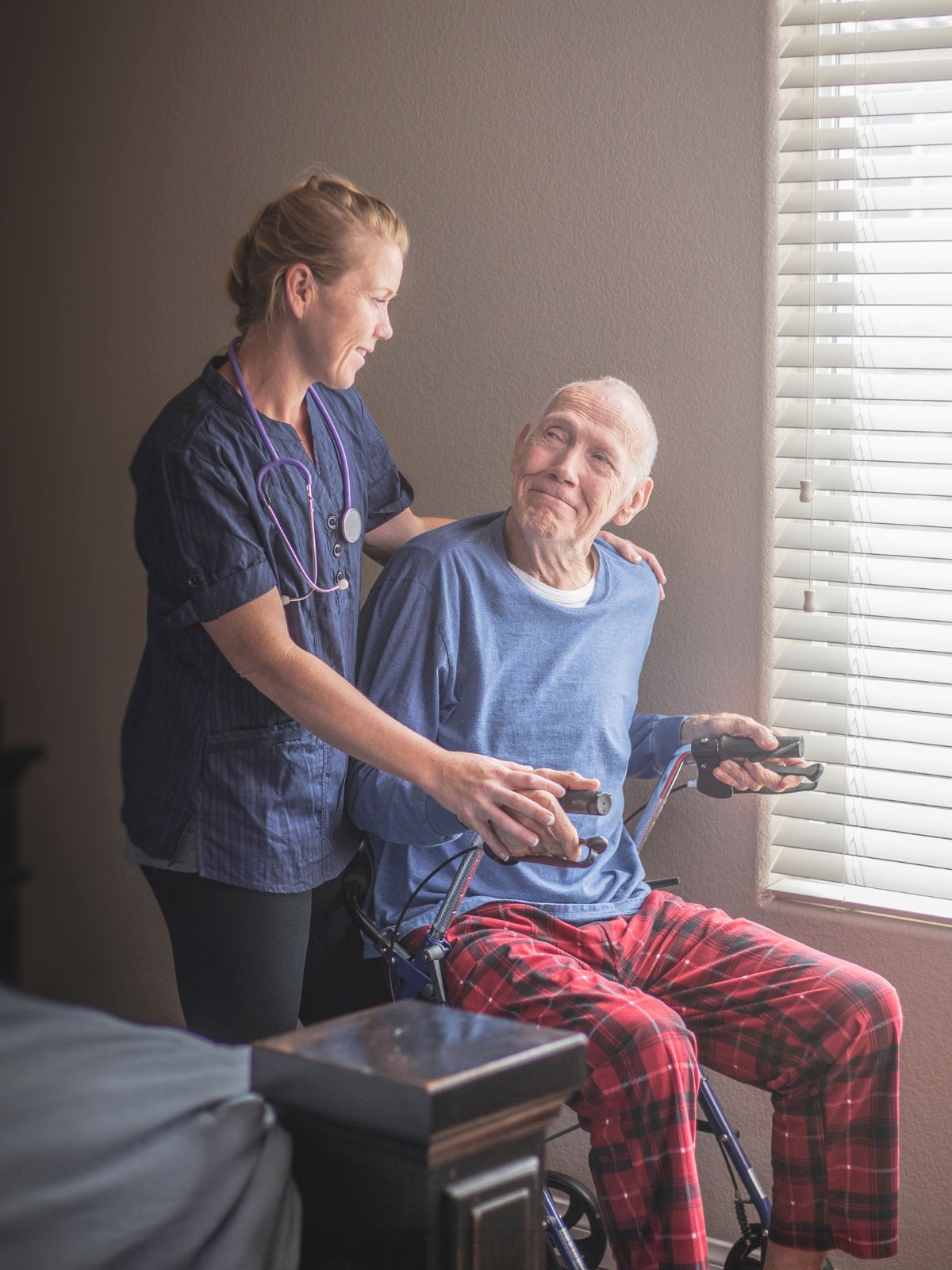Home care professional providing companionship to an elderly client